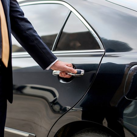 Businessman going inside his car